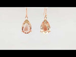 Load and play video in Gallery viewer, Glamorous Pear Shape Peach Oregon Sunstone Earring
