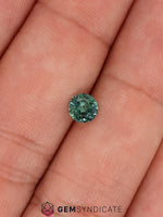 Load image into Gallery viewer, Flirty Round Teal Sapphire 0.67ct
