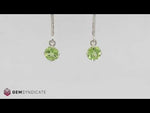 Load and play video in Gallery viewer, Vibrant Peridot Solitaire Dangle Birthstone Earrings
