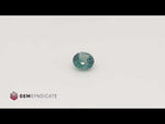 Load and play video in Gallery viewer, Flirty Round Teal Sapphire 0.67ct
