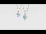 Load and play video in Gallery viewer, Whimsical Blue Topaz Solitaire Dangle Birthstone Earrings
